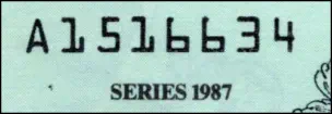 Sample image of a serial number on the 1987 Disney Dollar