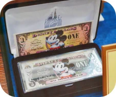 Store Display of the Silver Disney Dollar - Image Copyright www.blogdisney.com